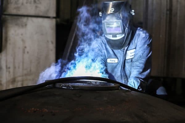 Welder at work on Manways | Baker Tankhead