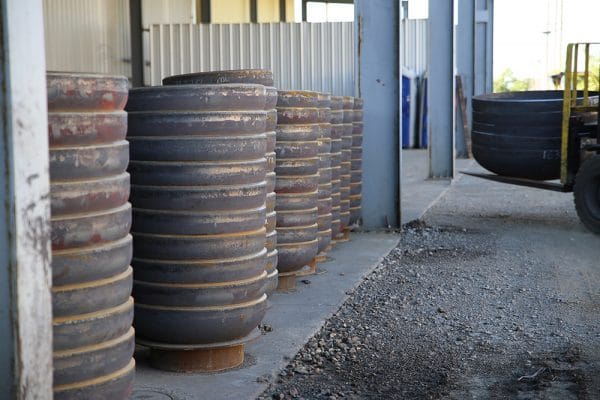 Tank Heads stacked in outdoor warehouse | Baker Tankhead